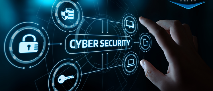 hand hovering over IT graphics and word "cybersecurity" over dark blue background