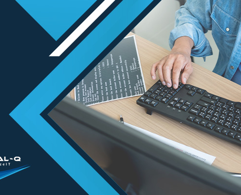 man types on keyboard next to blue and white background and Virtual-Q logo