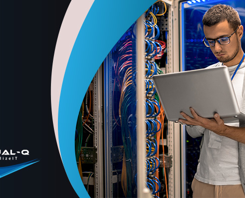 man holding laptop in data center next to multicolor background and Virtual-Q logo