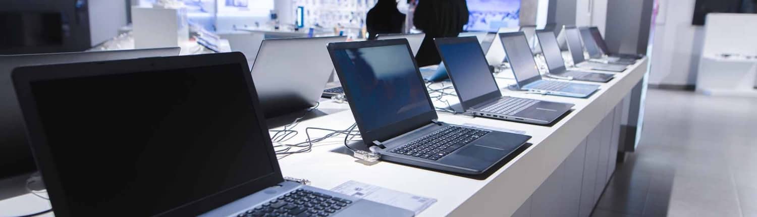 line of laptops in a store